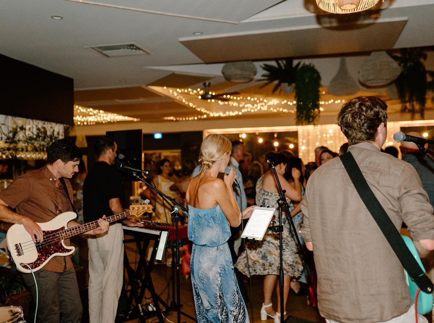 Blue Vinyl performing live at a Central Coast wedding reception, vocalist and guitarist with a full dance floor