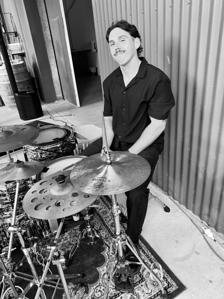 Blue Vinyl drummer at soundcheck in a barn venue